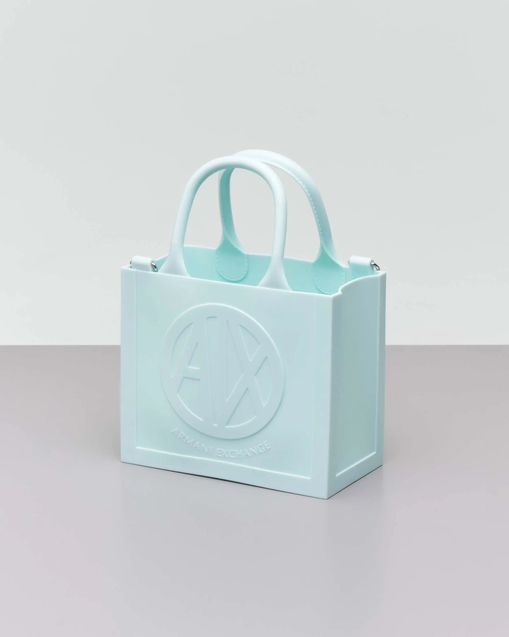 Borsa a mano color acqua misura piccola in gonna con scritta logo a rilievo e tracolla bicolore removibile