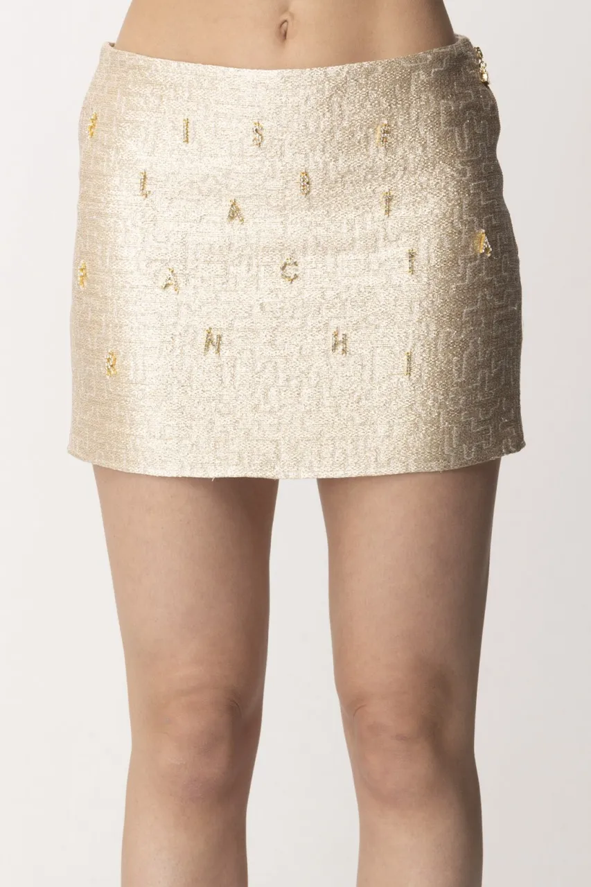 Minigonna in tweed con lettering in strass Oro