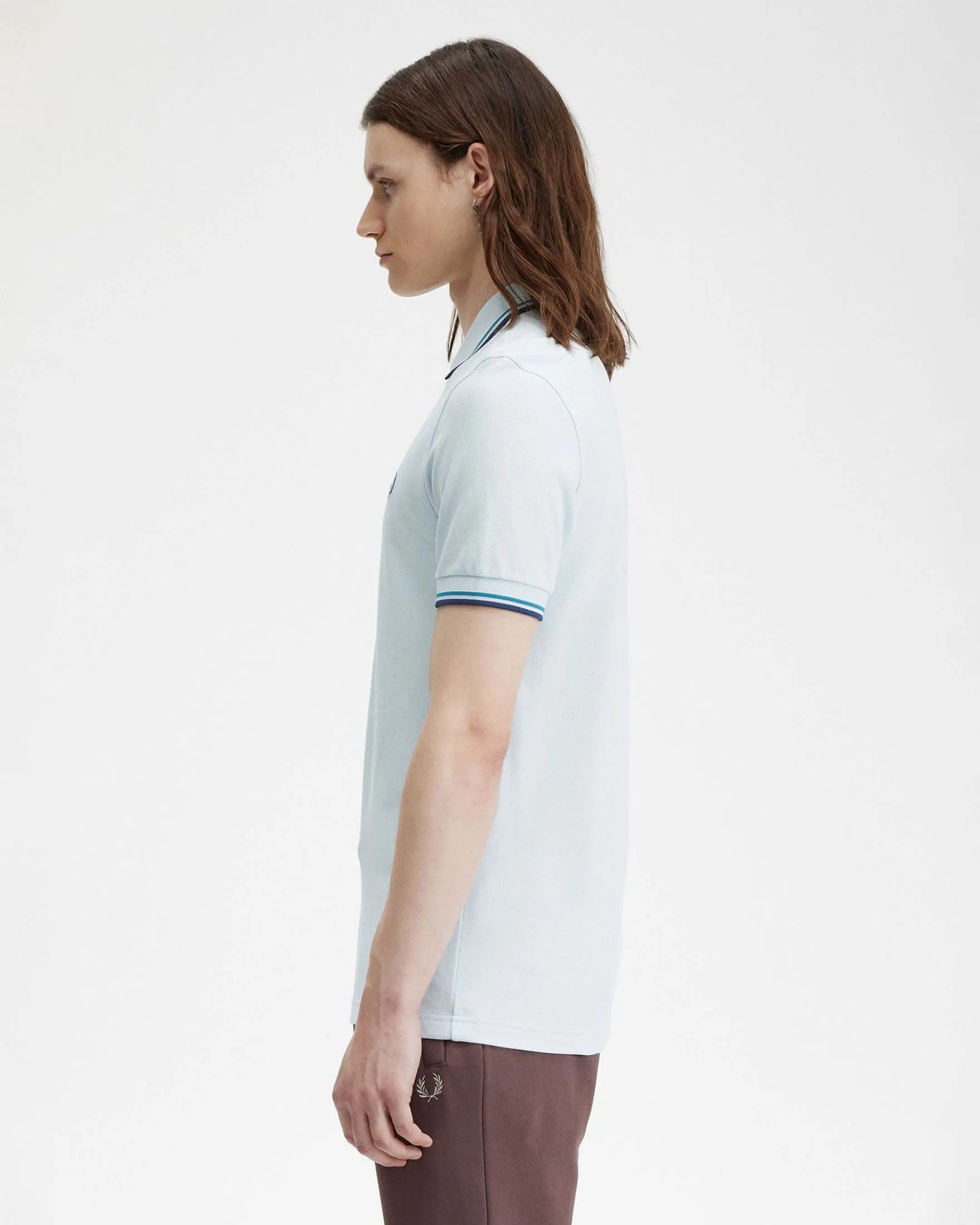 Polo mezza manica azzurra con bordino ottanio e blu indaco