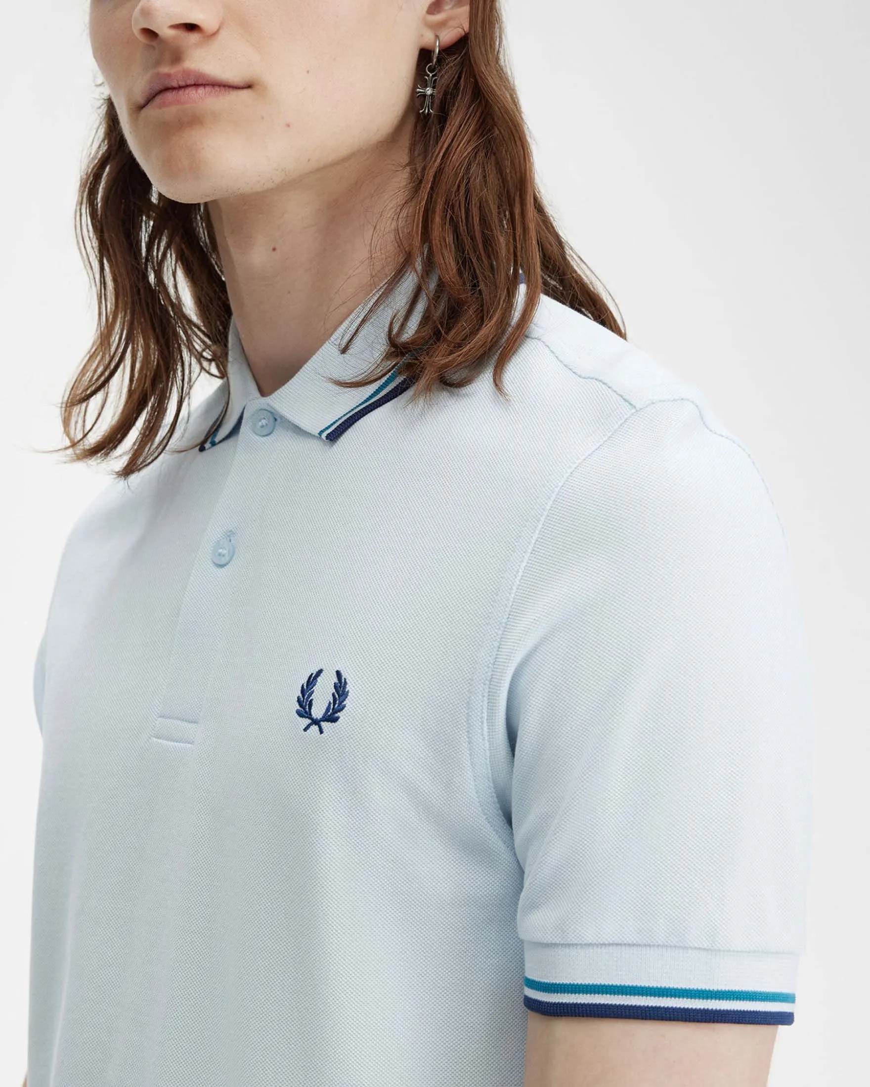 Polo mezza manica azzurra con bordino ottanio e blu indaco