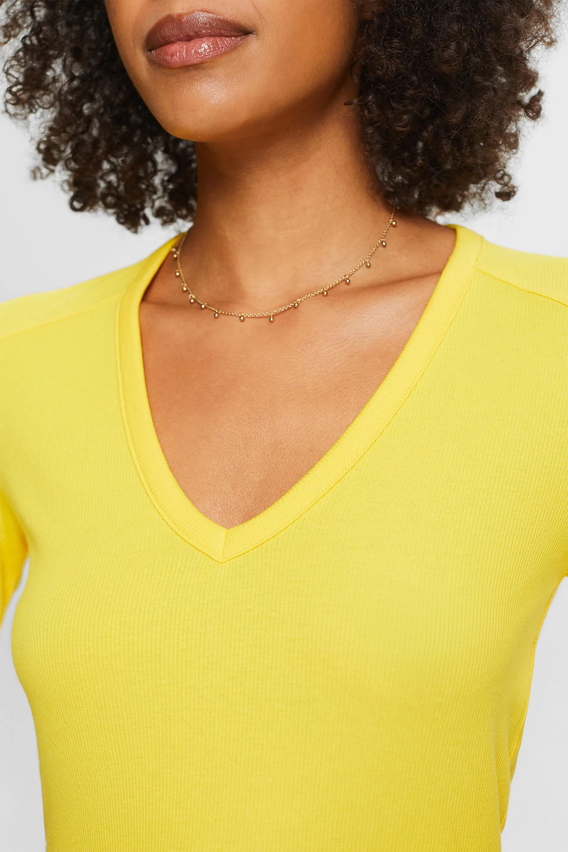 T-shirt a coste con scollo a V